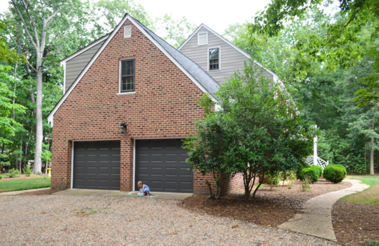 Brick house and black garage