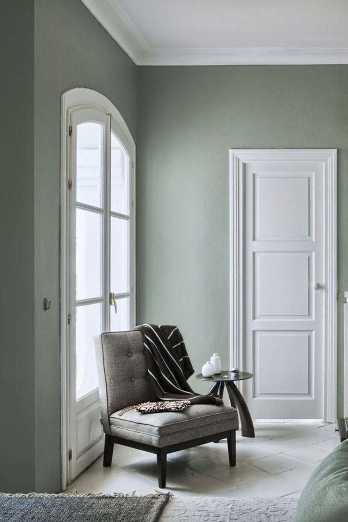 Gray flooring with sage green walls