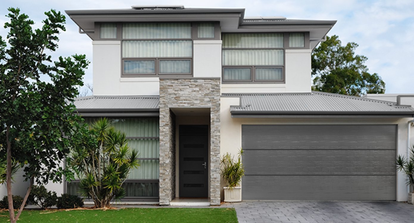 Gray house and black garage