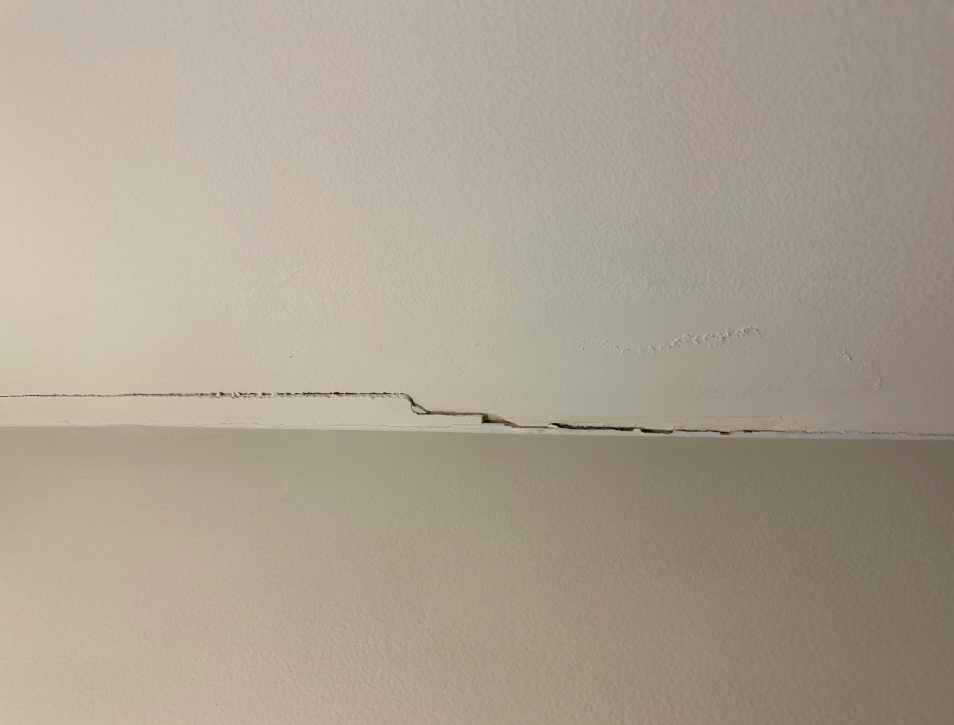 Peeling paint bathroom ceiling damage