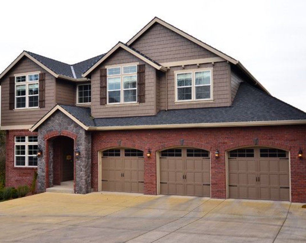 Red Brick Exterior with Warm Taupe Siding