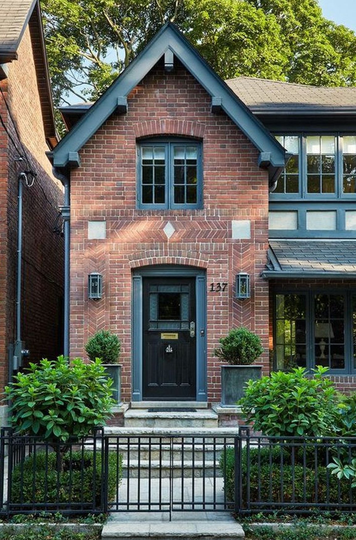 Red Brick Exterior with Moody Navy Accents