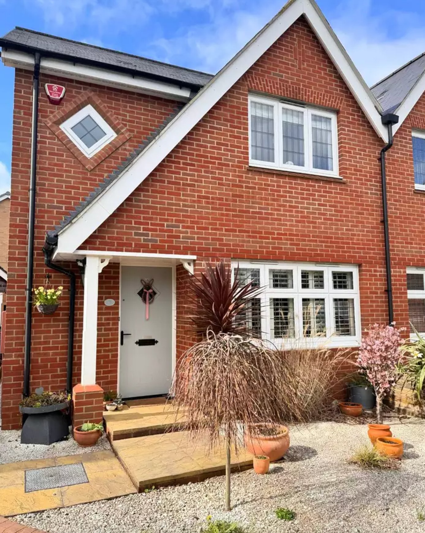Red Brick Exterior with Classic White Trim