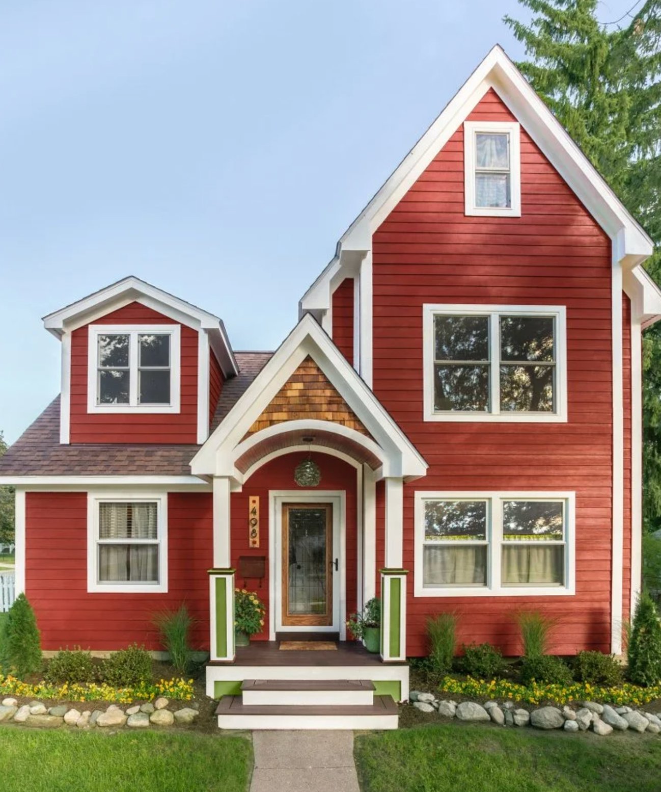 Red and white and green house exterior