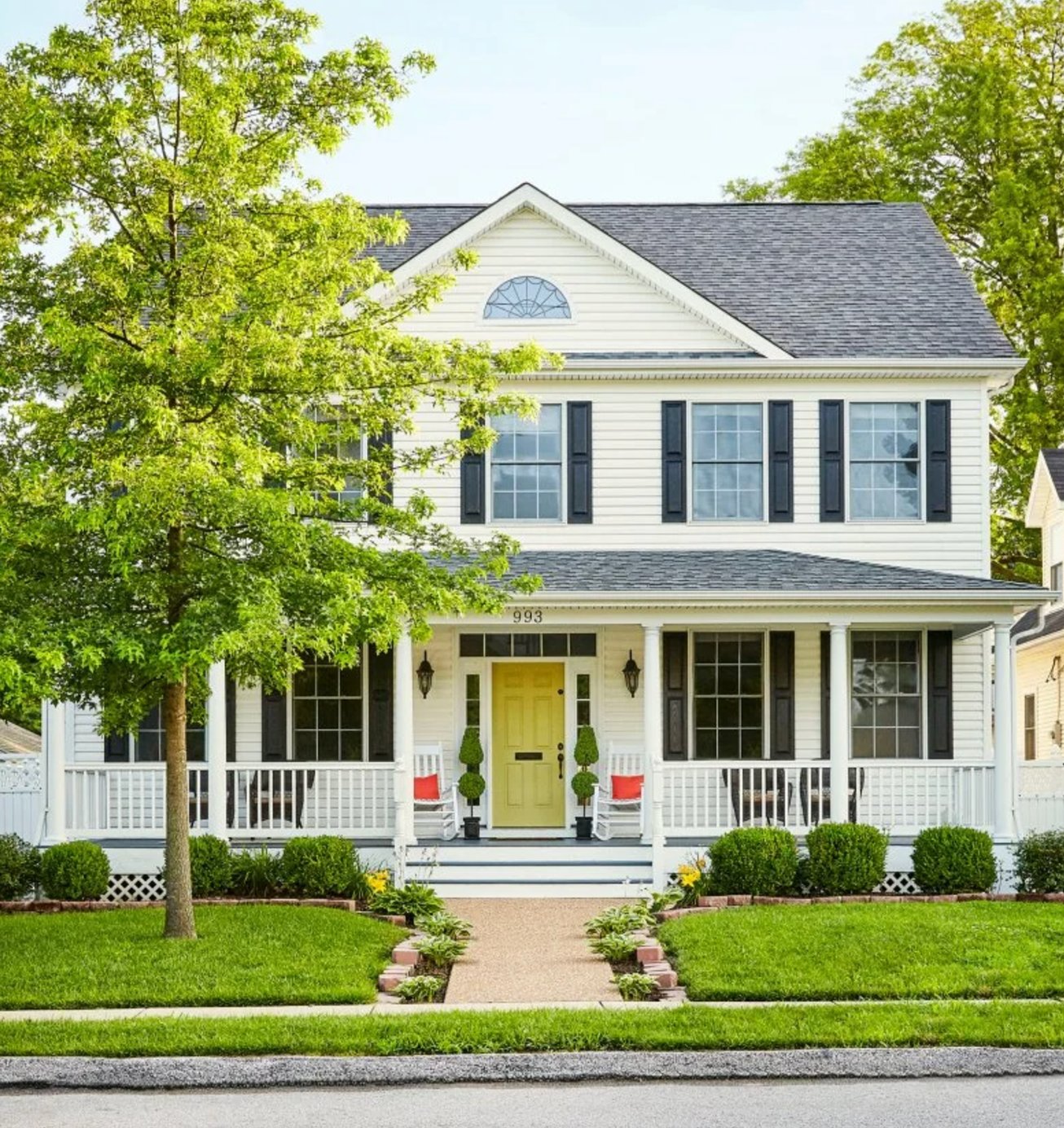 White and lime green house exterior